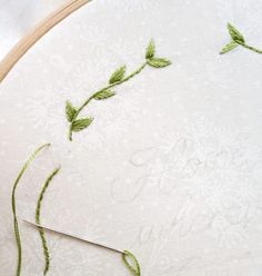 the embroidery is being worked on with scissors