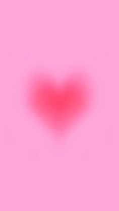 a red heart on a pink background with the light reflecting off it's side