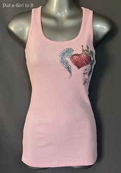 New Womens Vocal Apparel embellished crystal pink heart with wings sleeveless tank top Size small and medium - juniors Beautiful pink tank top embellished with stones. The front design is embellished with colorful. The back is a vibrant multi colored screen print. Beautiful Color.  Sold out with Vocal/Old School Style. Just GORGEOUS Made in USA by Vocal Apparel I have been selling Vocal clothing for over 15 YEARS now and just LOVE this brand! 100% Cotton - Has Little Stretch Measured without str Fitted Crew Neck Tank Top For Summer, Y2k Style Scoop Neck Summer Tops, Pink Racerback Top For Spring, Embellished Sleeveless Tops For Spring, Sleeveless Embellished Tops For Spring, Pink Stretch Tank Top, Summer Embellished Crew Neck Tops, Summer Y2k Tops With Scoop Neck, Casual Pink Embellished Tops