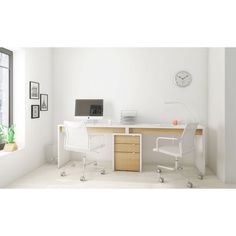 a white desk with two chairs and a clock on the wall