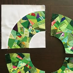 the letter c is made out of patchwork fabric and has been cut into smaller pieces