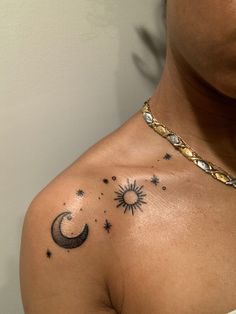 a man with a tattoo on his chest that has the sun and moon in it