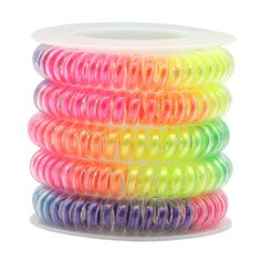 multicolored spoole bracelets are stacked on top of each other in different colors