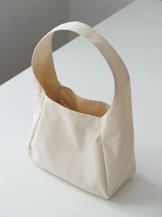 a white bag sitting on top of a table