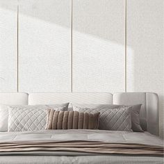 a bed with white sheets and pillows on it in front of three vertical wall panels