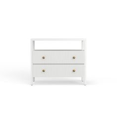 a white nightstand with two drawers and gold handles