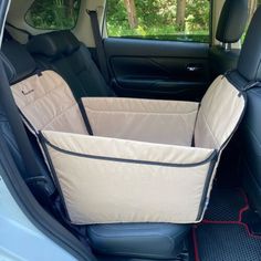 the back seats of a car with a dog bed in it's rear seat