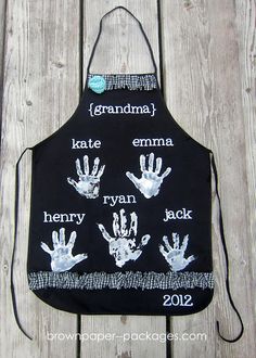 a black apron with hand prints on it