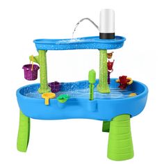 an inflatable water play table with toys and accessories for children to play in