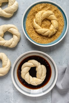 the bread is being prepared in bowls and ready to be eaten with sauce on the side