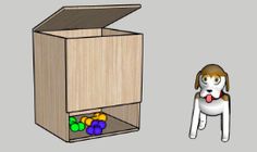 a dog standing next to a box with balls in it and another dog looking at the box