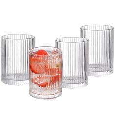 three clear glass tumblers with strawberries in them