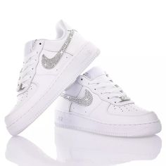 Nike Air Force 1 Swarovski, a cascade of rhinestones covers the "swoosh" of Nike's most iconic sneaker, making it unique, sparkling, and special. Nike Swarovski is also available in junior and baby models. | Mimanera Women's White Swarovski Nike Air Force 1 | SS24 Swarovski Nike, Nike Air Force 1 White, Air Force 1 White, Baby Models, Black Art Pictures, Prada Leather, Card Holder Leather, Nike Air Force 1, Custom Shoes