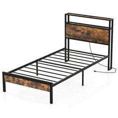 the bed frame is made out of wood and black metal, with no headboard or foot board