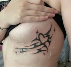 a woman with a tattoo on her stomach