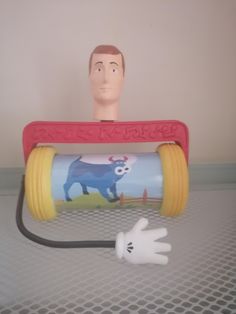 a plastic head is plugged in to a tube with an electric cord connected to it