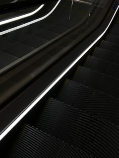 an escalator is shown with the lights on