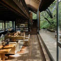 the inside of a house with wooden floors and walls