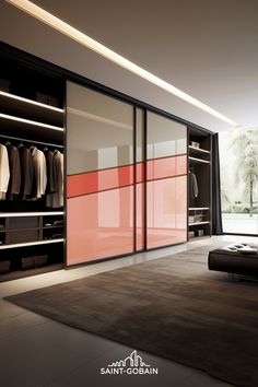 an open closet with clothes hanging on the walls and sliding doors, in front of a large window