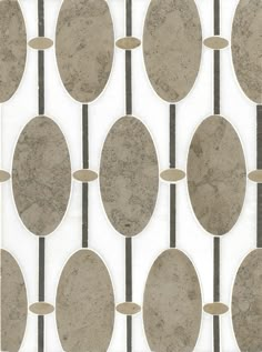 a tile pattern with circles and lines on it's surface, in grey and white colors