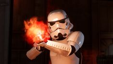 a star wars character is holding a flame lighter