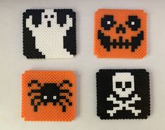 four halloween coasters made out of perler beads