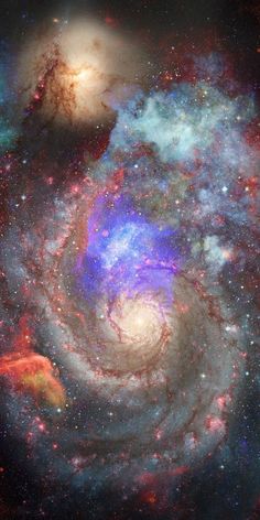 an image of two spiral galaxys in the sky