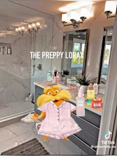 a stuffed animal is standing in front of a bathroom mirror with the words the preppy lorax on it