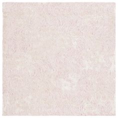 a white and pink rug with an abstract design on the bottom, it is very soft