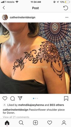 a woman's shoulder with henna tattoos on it