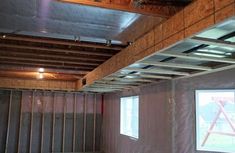 an unfinished room with metal beams and walls in the process of remodeling