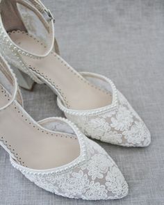 Crochet Lace Wedding Shoes Collection. Classic and refined almond toe crochet lace with mini pearl placed around the shoe and ankle strap. The delicate mini pearl beads are placed carefully by hand to create a graceful timeless bridal shoes.DETAILS:HEELS: 2.75 inches COLORS AVAILABLE: Ivory and WhiteUPPER: Synthetic upper and liningMATERIALS: Manmade outsoleORIGIN: ImportedSTYLE NAME: ABBY Quinceanera Shoes, Shoes For Brides, Flower Girl Shoes, Wedding Shoes Lace, Pointy Toe Heels, Wedding Vision, Women Flats, Bridesmaid Shoes, Bride Shoes