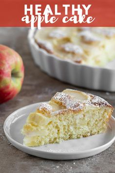 a slice of apple cake on a plate with the rest of the pie in the background