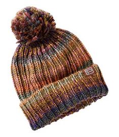 a multicolored knitted hat with a pom - pom