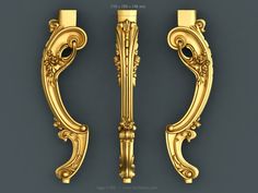 two golden door handles on a gray background