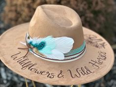 Wildflowers & Wild Horses Lainey Wilson Custom hand burned wide brimmed Boho Western Hat made to order just for you.  Colors: Cream Sand (Light Tan) Cognac (Dark Tan) When my dad passed away, I made my mom a hat to commemorate him... with places they've traveled, songs they sung, and things that reminded her of him. I loved it so much, I made myself one with my moms favorite Bible verse, my dads ammo casing and so many things I cherish. When I posted them to my friends, I started getting others Bohemian Felt Hat For Kentucky Derby And Western Events, Bohemian Felt Hat For Kentucky Derby, Bohemian Felt Hat For Festival, Fitted Bohemian Felt Hat For Festival, Handmade Bohemian Felt Hat For Rodeo, Handmade Country Style Felt Hat For Country Events, Handmade Bohemian Felt Hat For Ranch, Bohemian Felt Hat For Ranch, Custom Burned Felt Hats