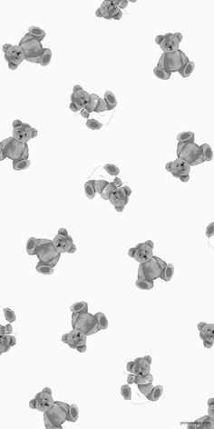 black and white photo of teddy bears flying in the air with strings attached to them