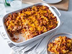 a casserole dish filled with meat and cheese