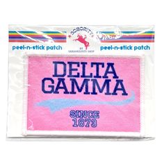 a pink patch with the words delta gamma on it