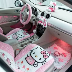 the interior of a car with hello kitty decorations