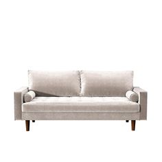 a white couch sitting on top of a wooden floor