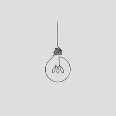 a single light bulb hanging from a wire on a gray background with the word,