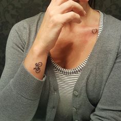 a woman with a small tattoo on her wrist