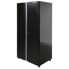 a tall black refrigerator freezer sitting on top of a white floor