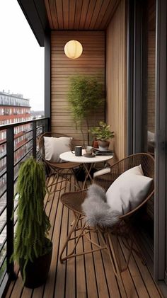 a balcony with chairs, tables and plants on it