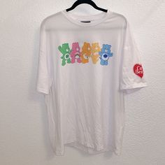 Care Bears X Romwe Collaboration White Short Sleeve Tee Shirt Colorful Care Bear Image On The Front Red Heart Care Bears Logo On Left Sleeve Never Worn, Nwt Size L P Casual Tops With White Funny Print, Fun White Printed Tops, Cute White Tops For Streetwear, Casual White Print Tops For Streetwear, Casual White Printed Shirt, Cute White T-shirt For Streetwear, Red Casual Top With Funny Print, Cute Printed White Shirt, Casual Red Top With Funny Print