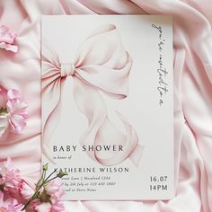 a baby shower is shown with pink flowers