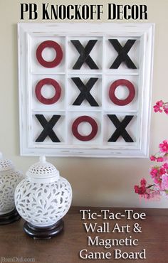 a tic - tac - toe wall art and magnetic game board is displayed