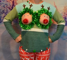 a woman wearing ugly christmas sweaters with fake reindeer's on her eyes and nose