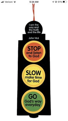 a traffic light with stickers on it saying stop and listen to god, slow make time for god